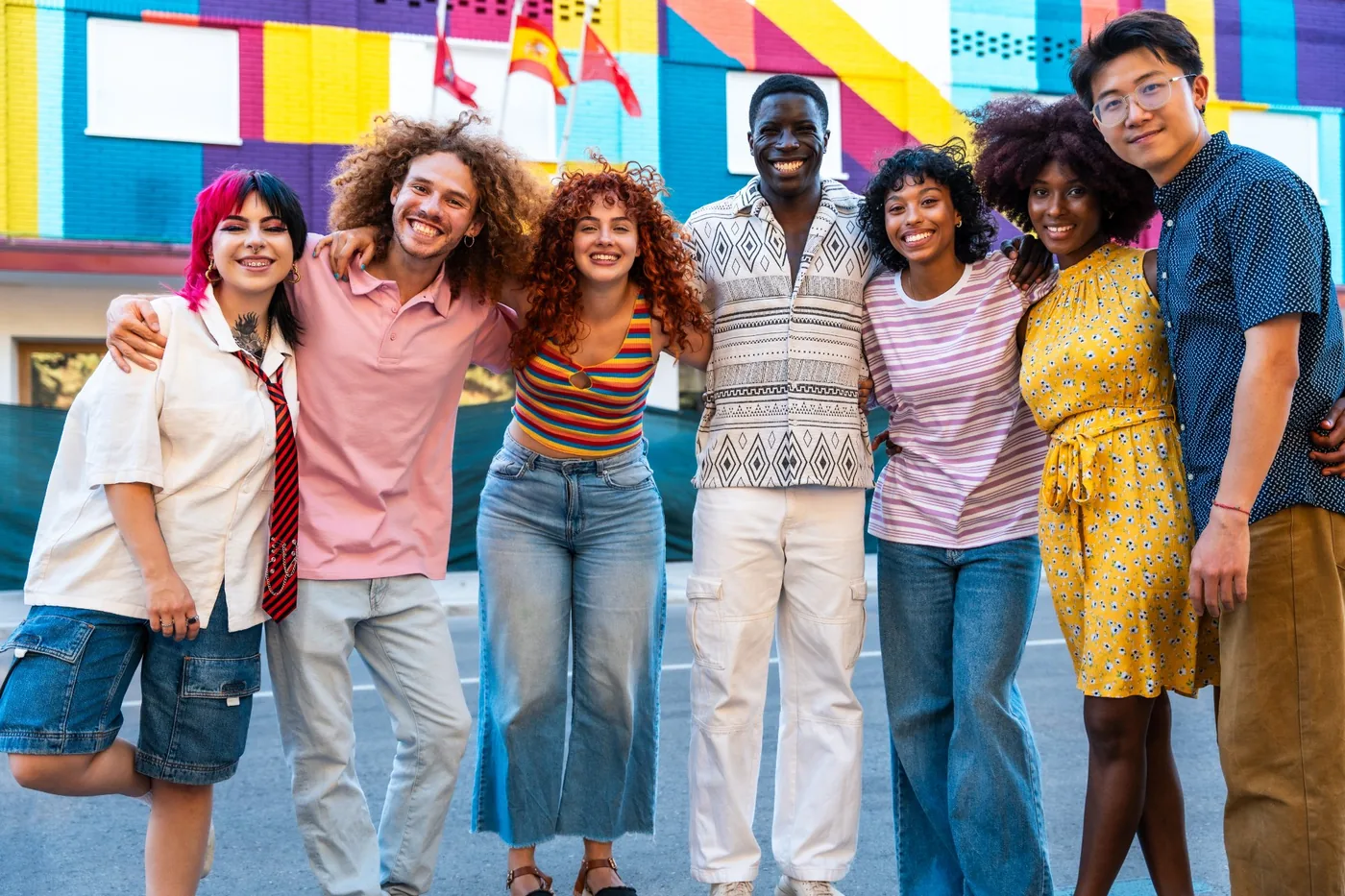 Diverse group of young people smiling together outdoors